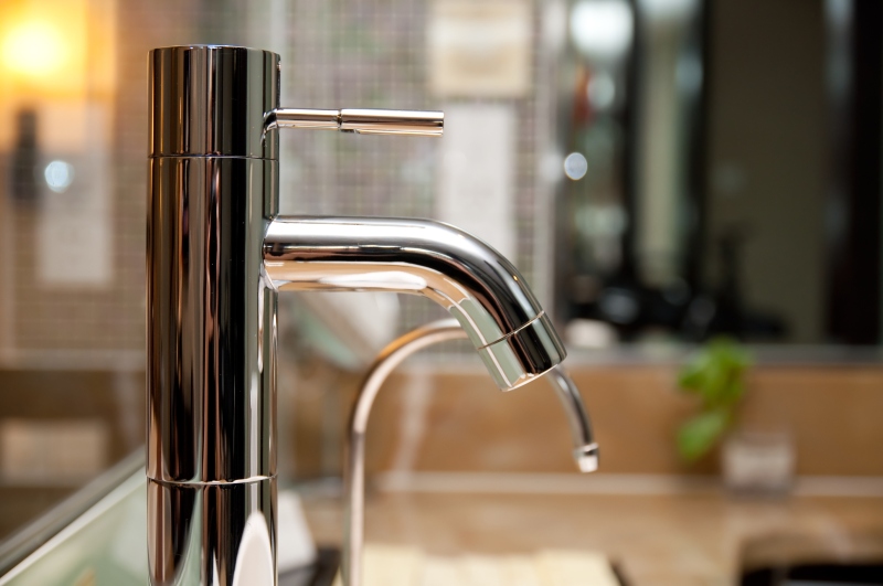 Leaking tap being repaired in Hampton Hill